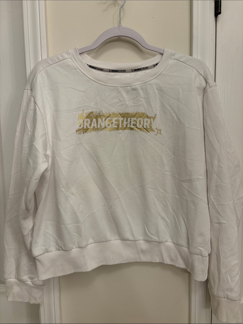 Orangetheory White Sweatshirt with Gold Logo Brushstroke